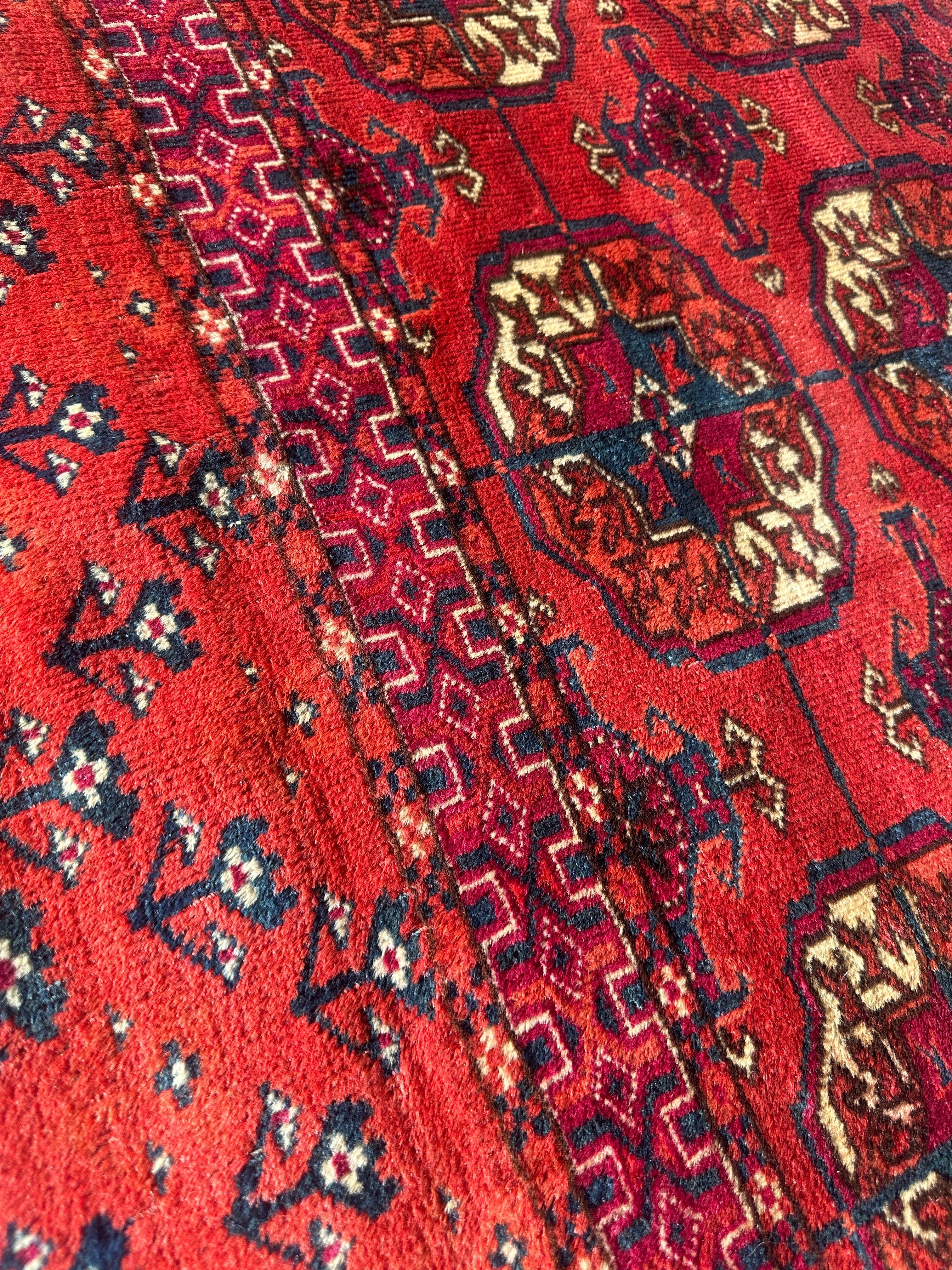 Antique Turkmen Bokhara rug with repeating gul medallion pattern